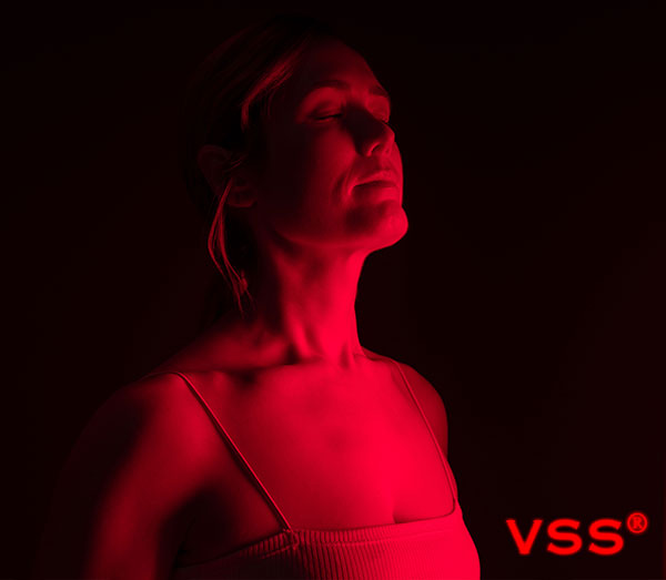 Woman in front of VSS full-spectrum heater